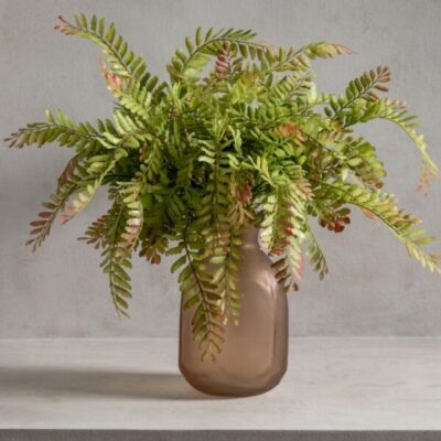 Lifelike faux plant in a chic brown vase, seamlessly blending natural aesthetics with modern design. Perfect for adding greenery to any space with minimal maintenance.