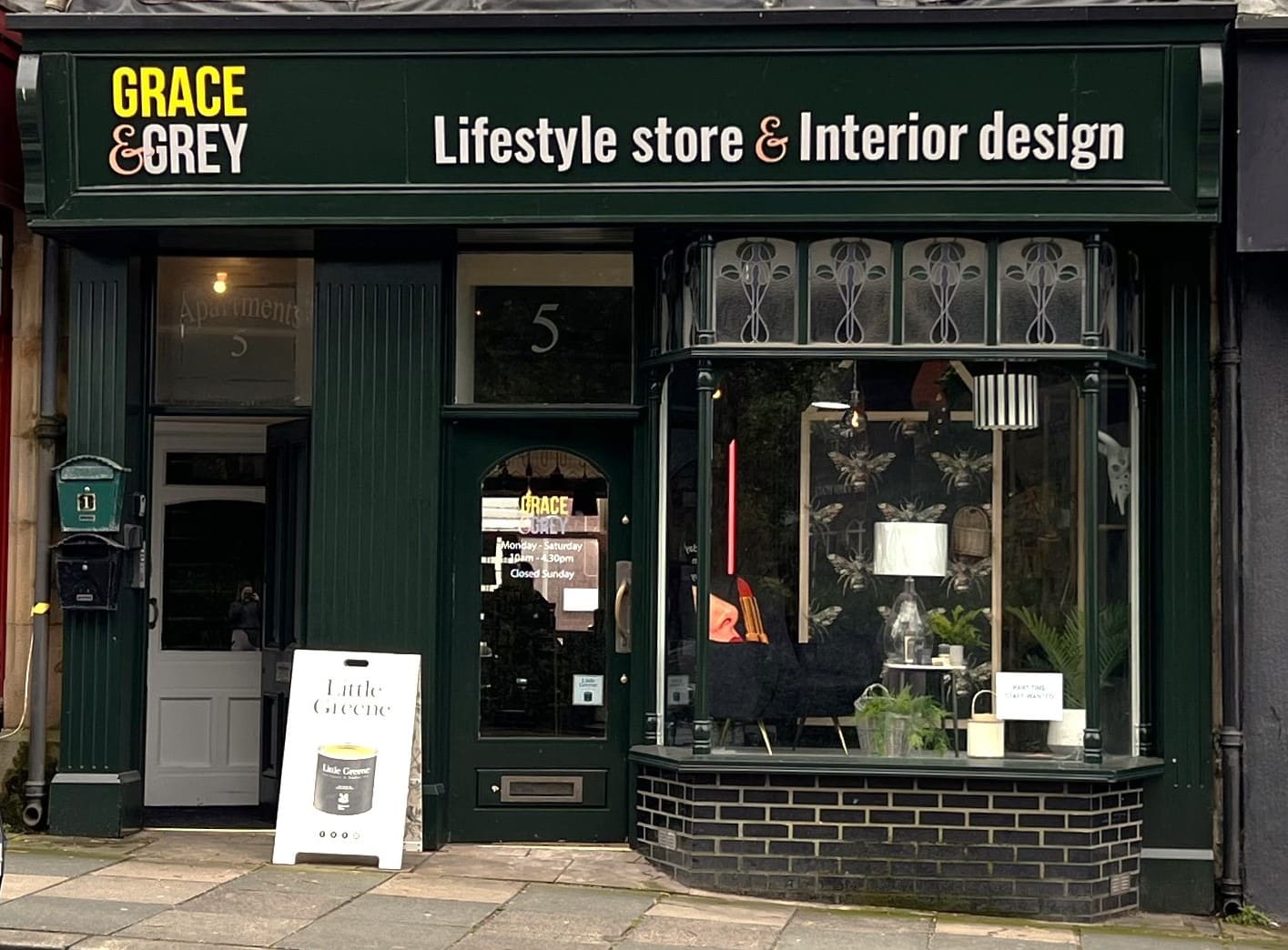 Grace and Grey shop front, showing bay window with stained glass.